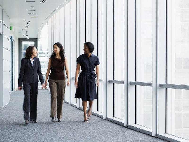 businesswoman-walking-hallway-public-sector